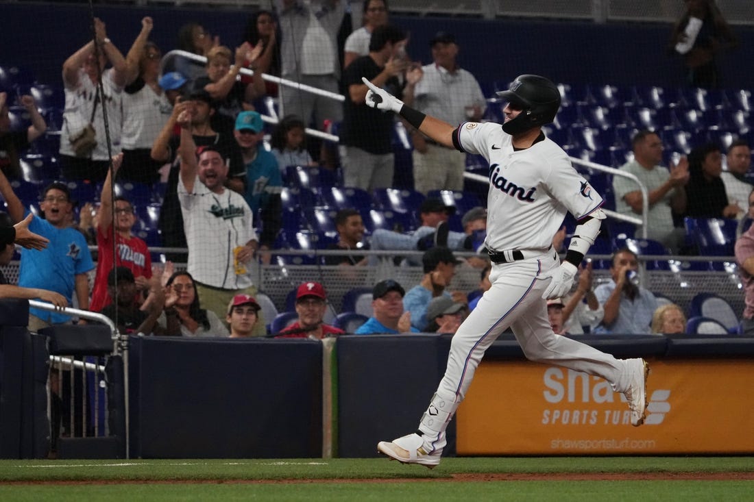 Sep 15, 2022; Miami, Florida, USA; Miami Marlins third baseman Jordan Groshans (65) celebrates while rounding the bases after hitting a solo home run in the third inning against the Philadelphia Phillies at loanDepot park. Mandatory Credit: Jasen Vinlove-USA TODAY Sports