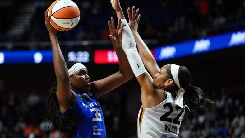 Sep 15, 2022; Uncasville, Connecticut, USA; Connecticut Sun forward Jonquel Jones (35) shoots against Las Vegas Aces forward A'ja Wilson (22) in the first quarter during game three of the 2022 WNBA Finals at Mohegan Sun Arena. Mandatory Credit: David Butler II-USA TODAY Sports