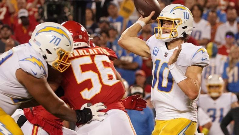 Sep 15, 2022; Kansas City, Missouri, USA; Los Angeles Chargers quarterback Justin Herbert (10) throws against the Kansas City Chiefs during the second half at GEHA Field at Arrowhead Stadium. Mandatory Credit: Denny Medley-USA TODAY Sports