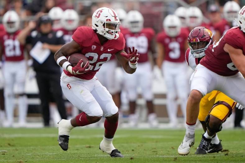 Sep 10, 2022; Stanford, California, USA;  Stanford Cardinal running back E.J. Smith (22) runs with the football during the first quarter against the USC Trojans at Stanford Stadium. Mandatory Credit: Stan Szeto-USA TODAY Sports