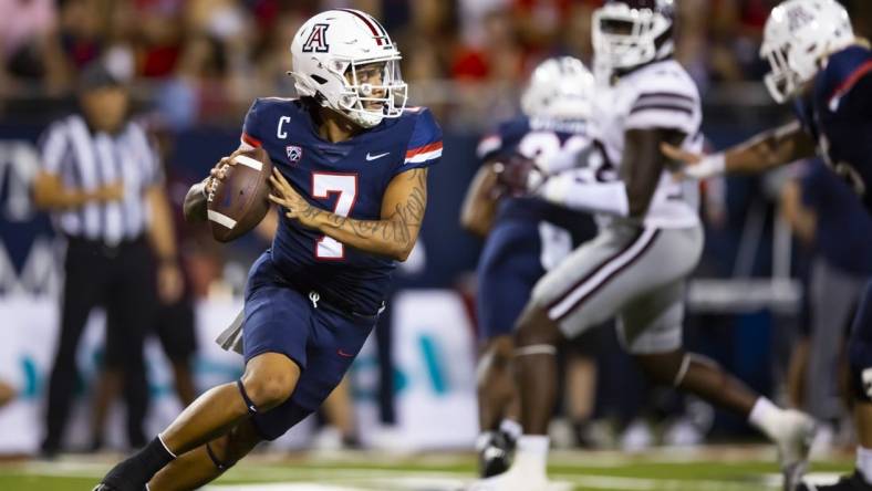 Sep 10, 2022; Tucson, Arizona, USA; Arizona Wildcats quarterback Jayden de Laura (7) against the Mississippi State Bulldogs at Arizona Stadium. Mandatory Credit: Mark J. Rebilas-USA TODAY Sports