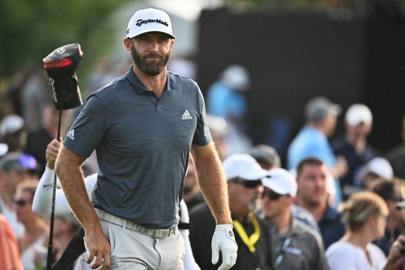 Sep 16, 2022; Chicago, Illinois, USA; Dustin Johnson walks up the 18th fairway during the first round of a LIV Golf tournament at Rich Harvest Farms. Mandatory Credit: Jamie Sabau-USA TODAY Sports