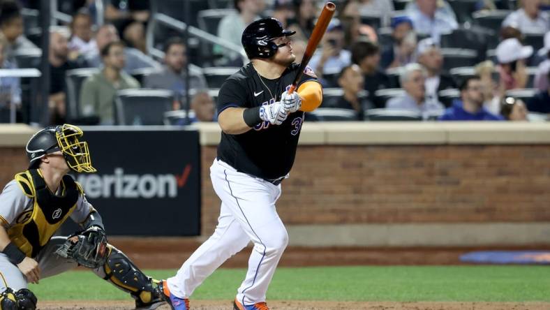 Sep 16, 2022; New York City, New York, USA; New York Mets designated hitter Daniel Vogelbach (32) follows through on a solo home run against the Pittsburgh Pirates during the fourth inning at Citi Field. Mandatory Credit: Brad Penner-USA TODAY Sports