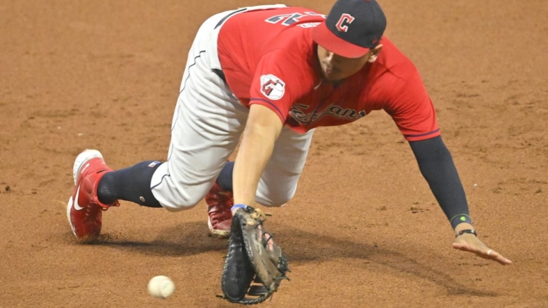 Sep 16, 2022; Cleveland, Ohio, USA; Cleveland Guardians first baseman Josh Naylor (22) dives for a ground ball in the third inning against the Minnesota Twins at Progressive Field. Mandatory Credit: David Richard-USA TODAY Sports