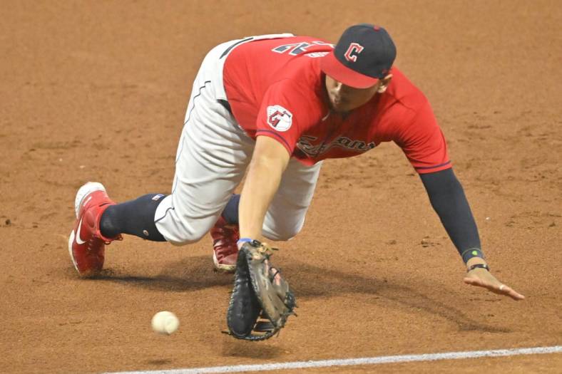 Sep 16, 2022; Cleveland, Ohio, USA; Cleveland Guardians first baseman Josh Naylor (22) dives for a ground ball in the third inning against the Minnesota Twins at Progressive Field. Mandatory Credit: David Richard-USA TODAY Sports