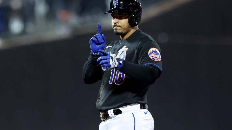 Sep 16, 2022; New York City, New York, USA; New York Mets third baseman Eduardo Escobar (10) reacts after hitting a double against the Pittsburgh Pirates during the seventh inning at Citi Field. Mandatory Credit: Brad Penner-USA TODAY Sports