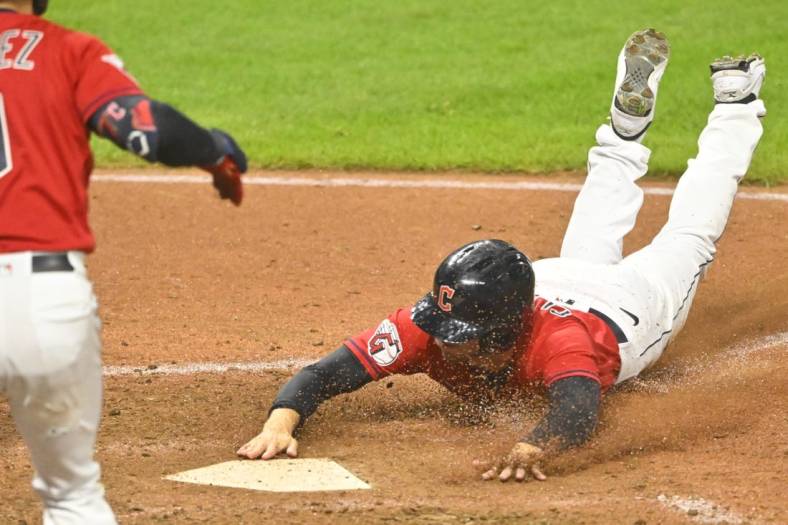 Sep 16, 2022; Cleveland, Ohio, USA; Cleveland Guardians pinch runner Ernie Clement (28) scores from second base on a wild pitch in the eighth inning against the Minnesota Twins at Progressive Field. Mandatory Credit: David Richard-USA TODAY Sports