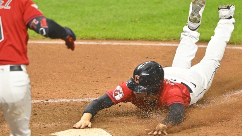 Sep 16, 2022; Cleveland, Ohio, USA; Cleveland Guardians pinch runner Ernie Clement (28) scores from second base on a wild pitch in the eighth inning against the Minnesota Twins at Progressive Field. Mandatory Credit: David Richard-USA TODAY Sports