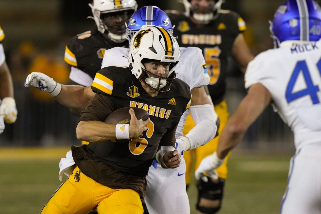 Sep 16, 2022; Laramie, Wyoming, USA; Wyoming Cowboys quarterback Andrew Peasley (6) runs against the Air Force  during the fourth quarter at Jonah Field at War Memorial Stadium. Mandatory Credit: Troy Babbitt-USA TODAY Sports