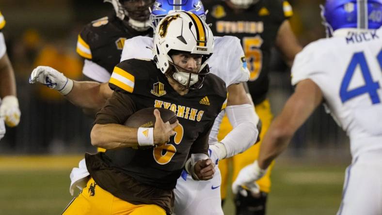 Sep 16, 2022; Laramie, Wyoming, USA; Wyoming Cowboys quarterback Andrew Peasley (6) runs against the Air Force  during the fourth quarter at Jonah Field at War Memorial Stadium. Mandatory Credit: Troy Babbitt-USA TODAY Sports