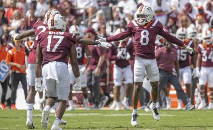 Sep 17, 2022; Blacksburg, Virginia, USA; Virginia Tech Hokies defender Brion Murray ( 8 ) celebrates with teammates after forcing the Wofford Terriers offense to punt in the second quarter at Lane Stadium. Mandatory Credit: Lee Luther Jr.-USA TODAY Sports