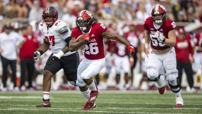 Sep 17, 2022; Bloomington, Indiana, USA;  Indiana Hoosiers running back Josh Henderson (26) runs the ball during the second quarter against the Western Kentucky Hilltoppers at Memorial Stadium. Mandatory Credit: Marc Lebryk-USA TODAY Sports