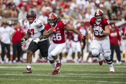 Sep 17, 2022; Bloomington, Indiana, USA;  Indiana Hoosiers running back Josh Henderson (26) runs the ball during the second quarter against the Western Kentucky Hilltoppers at Memorial Stadium. Mandatory Credit: Marc Lebryk-USA TODAY Sports