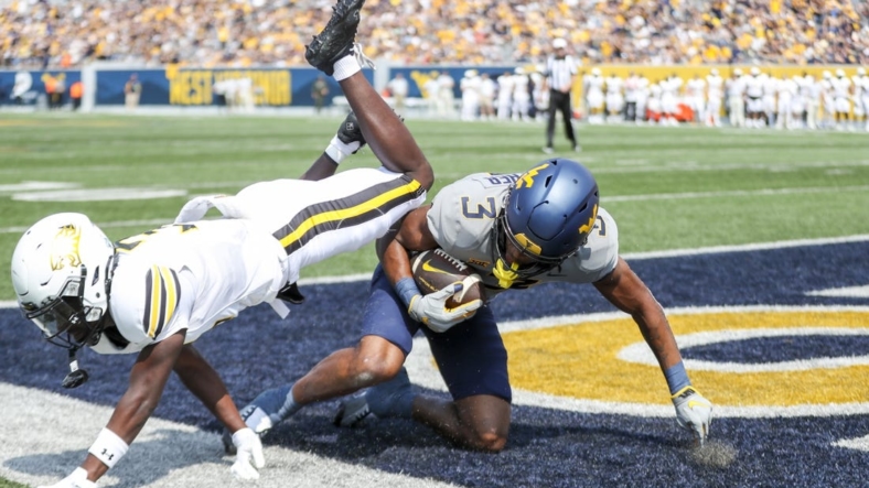 Sep 17, 2022; Morgantown, West Virginia, USA; West Virginia Mountaineers wide receiver Kaden Prather (3) catches a pass for a touchdown during the first quarter against the Towson Tigers at Mountaineer Field at Milan Puskar Stadium. Mandatory Credit: Ben Queen-USA TODAY Sports