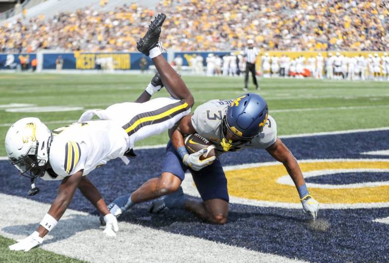 Sep 17, 2022; Morgantown, West Virginia, USA; West Virginia Mountaineers wide receiver Kaden Prather (3) catches a pass for a touchdown during the first quarter against the Towson Tigers at Mountaineer Field at Milan Puskar Stadium. Mandatory Credit: Ben Queen-USA TODAY Sports