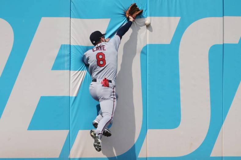 Sep 17, 2022; Cleveland, Ohio, USA; Minnesota Twins left fielder Jake Cave (8) misses a ball hit by Cleveland Guardians second baseman Andres Gimenez (not pictured) during the fourth inning at Progressive Field. Mandatory Credit: Ken Blaze-USA TODAY Sports