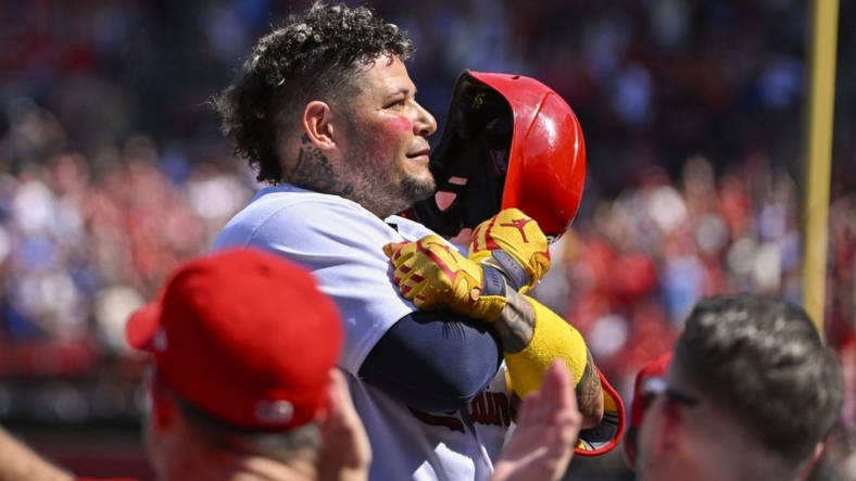 Sep 17, 2022; St. Louis, Missouri, USA;  St. Louis Cardinals catcher Yadier Molina (4) salutes the fans as he receives a standing ovation after hitting a two run home run against the Cincinnati Reds during the third inning at Busch Stadium. Mandatory Credit: Jeff Curry-USA TODAY Sports
