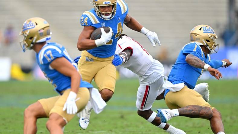 Sep 17, 2022; Pasadena, California, USA; UCLA Bruins running back Zach Charbonnet (24) carries the ball for a first down in the first half against the South Alabama Jaguars at the Rose Bowl. Mandatory Credit: Jayne Kamin-Oncea-USA TODAY Sports