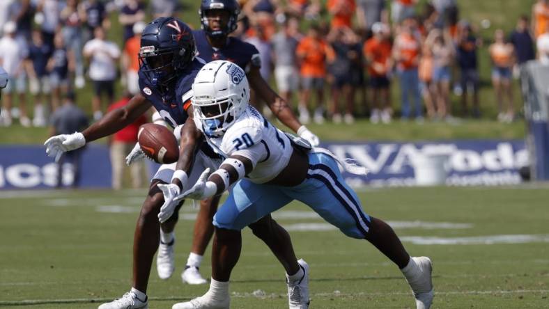 Sep 17, 2022; Charlottesville, Virginia, USA; Virginia Cavaliers wide receiver Dontayvion Wicks (3) attempts to make a catch as Old Dominion Monarchs cornerback Tobias Harris (20) defends during the first quarter at Scott Stadium. Mandatory Credit: Geoff Burke-USA TODAY Sports