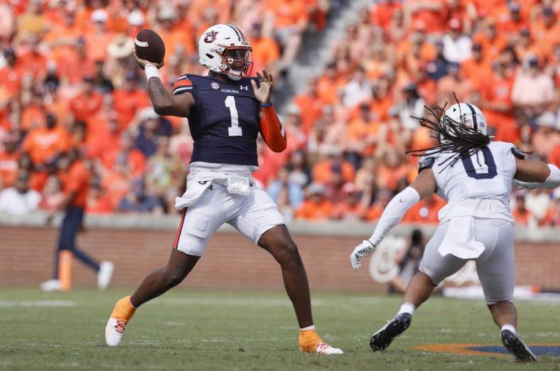 Sep 17, 2022; Auburn, Alabama, USA; Auburn Tigers quarterback T.J. Finley (1) throws a pass against the Penn State Nittany Lions during the first quarter at Jordan-Hare Stadium. Mandatory Credit: John Reed-USA TODAY Sports