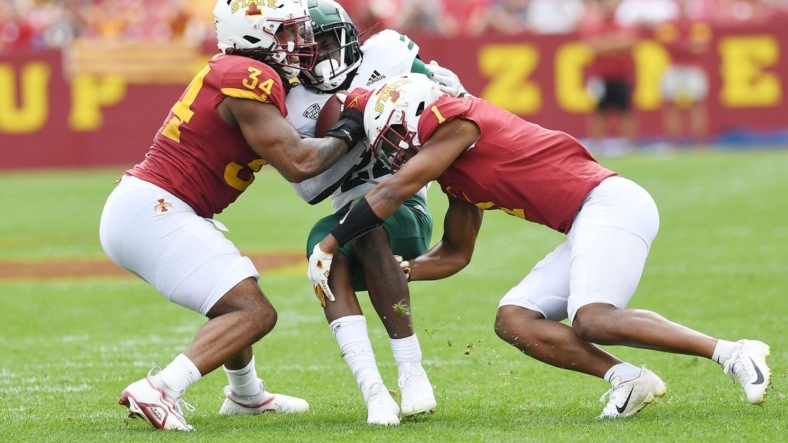 Iowa State Cyclones linebacker O'Rien Vance (34) and  defensive back Anthony Johnson Jr. (1) takes down Ohio Bobcats running back Sieh Bangura (22) during the first quarter at Jack Trice Stadium Saturday, Sept. 17, 2022, in Ames, Iowa.
