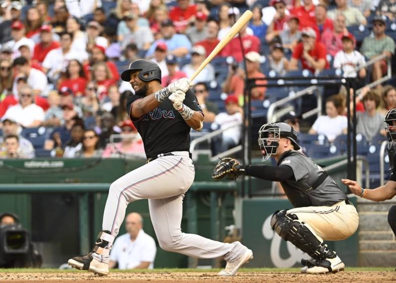Sep 17, 2022; Washington, District of Columbia, USA; Miami Marlins left fielder Jerar Encarnacion (64) hits a two run home run against the Washington Nationals during the fourth inning at Nationals Park. Mandatory Credit: Brad Mills-USA TODAY Sports