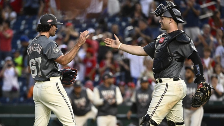 Sep 17, 2022; Washington, District of Columbia, USA; Washington Nationals relief pitcher Kyle Finnegan (67) is congratulated by catcher Riley Adams (15) after earning a save against the Miami Marlins at Nationals Park. Mandatory Credit: Brad Mills-USA TODAY Sports