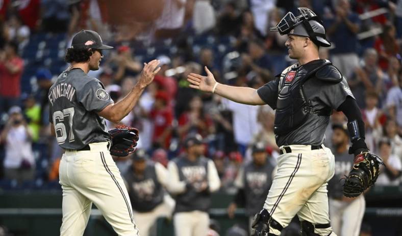 Sep 17, 2022; Washington, District of Columbia, USA; Washington Nationals relief pitcher Kyle Finnegan (67) is congratulated by catcher Riley Adams (15) after earning a save against the Miami Marlins at Nationals Park. Mandatory Credit: Brad Mills-USA TODAY Sports