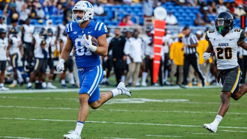 Sep 17, 2022; Durham, North Carolina, USA;  Duke Blue Devils tight end Nicky Dalmolin (81) scores a touchdown against the North Carolina A&T Aggies during the first half at Wallace Wade Stadium. Mandatory Credit: Jaylynn Nash-USA TODAY Sports