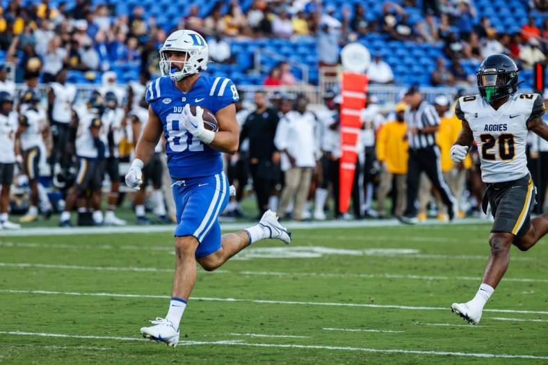 Sep 17, 2022; Durham, North Carolina, USA;  Duke Blue Devils tight end Nicky Dalmolin (81) scores a touchdown against the North Carolina A&T Aggies during the first half at Wallace Wade Stadium. Mandatory Credit: Jaylynn Nash-USA TODAY Sports