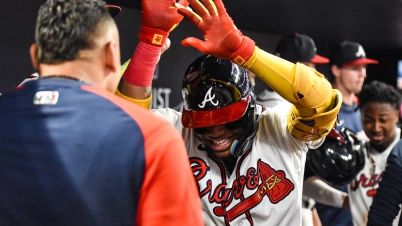 Sep 17, 2022; Cumberland, Georgia, USA; Atlanta Braves right fielder Ronald Acuna Jr. (13) celebrates after hitting a two-run home run against the Philadelphia Phillies in the third inning at Truist Park. Mandatory Credit: Larry Robinson-USA TODAY Sports