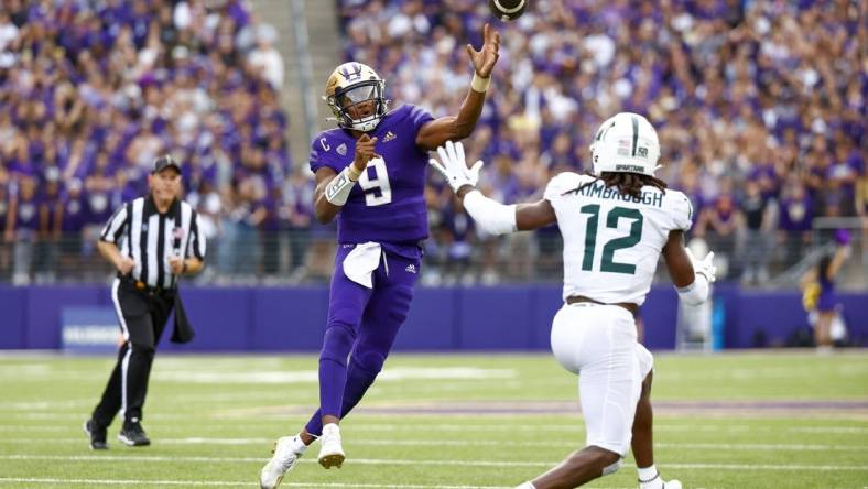 Sep 17, 2022; Seattle, Washington, USA; Washington Huskies quarterback Michael Penix Jr. (9) throws a touchdown pass against the Michigan State Spartans during the second quarter at Alaska Airlines Field at Husky Stadium. Mandatory Credit: Joe Nicholson-USA TODAY Sports