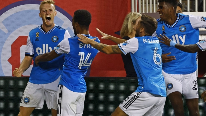 Sep 17, 2022; Chicago, Illinois, USA; Charlotte FC forward Karol Swiderski (11) reacts after scoring the winning goal against the Chicago Fire during the second half at Soldier Field. Mandatory Credit: Mike Dinovo-USA TODAY Sports