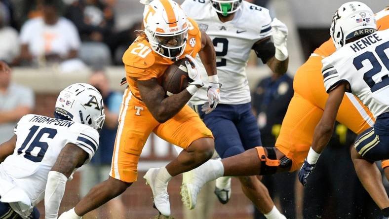 Tennessee running back Jaylen Wright (20) runs between Akron defenders during Tennessee  s football game against Akron in Neyland Stadium in Knoxville, Tenn., on Saturday, Sept. 17, 2022.

Kns Ut Akron Football