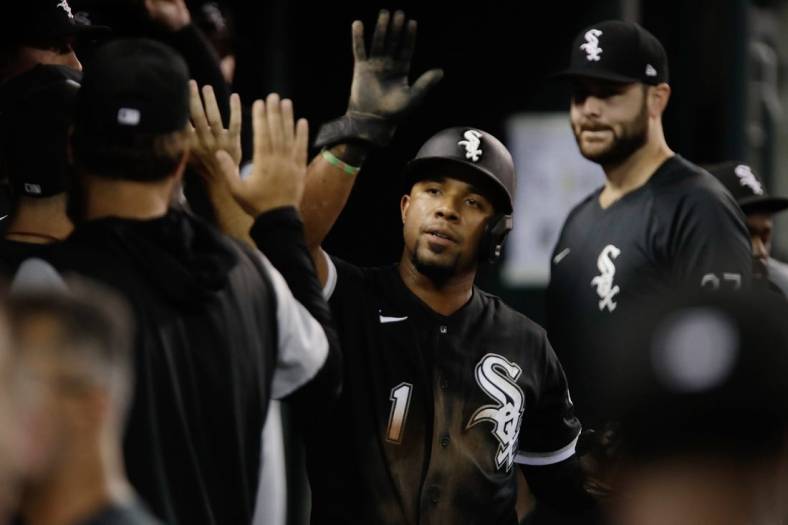 Sep 17, 2022; Detroit, Michigan, USA; Chicago White Sox shortstop Elvis Andrus (1) high fives teammates in the dugout after scoring a run against the Detroit Tigers at Comerica Park. Mandatory Credit: Brian Sevald-USA TODAY Sports