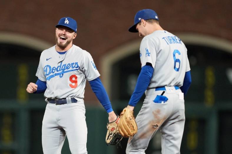 Sep 17, 2022; San Francisco, California, USA; /Los Angeles Dodgers second baseman Gavin Lux (9) and shortstop Trea Turner (6) talk during the fourth inning against the San Francisco Giants at Oracle Park. Mandatory Credit: Darren Yamashita-USA TODAY Sports