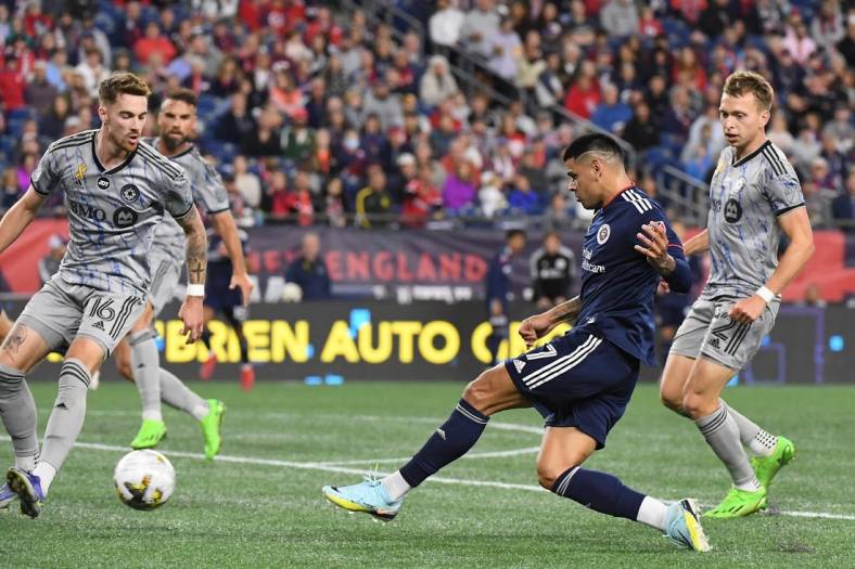 Sep 17, 2022; Foxborough, Massachusetts, USA; New England Revolution forward Gustavo Bou (7) shoots against the CF Montreal during the second half at Gillette Stadium. Mandatory Credit: Eric Canha-USA TODAY Sports