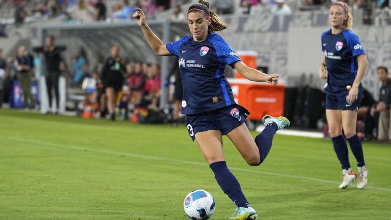 Sep 17, 2022; San Diego, California, USA; San Diego Wave FC forward Alex Morgan (13) passes the ball against Angel City FC in the first half at Snapdragon Stadium. Mandatory Credit: Ray Acevedo-USA TODAY Sports