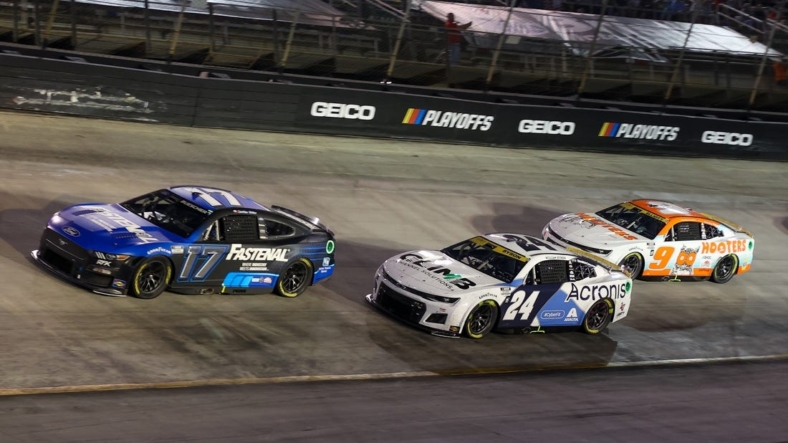 Sep 17, 2022; Bristol, Tennessee, USA; NASCAR Cup Series driver Chris Buescher (17) leads driver William Byron (24) and driver Chase Elliott (9) on a restart during the Bass Pro Shops Night Race at Bristol Motor Speedway. Mandatory Credit: Randy Sartin-USA TODAY Sports