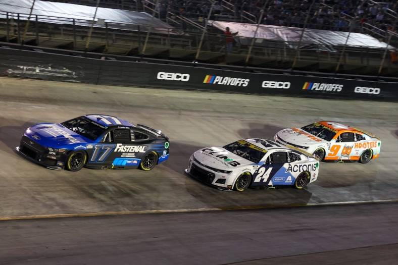 Sep 17, 2022; Bristol, Tennessee, USA; NASCAR Cup Series driver Chris Buescher (17) leads driver William Byron (24) and driver Chase Elliott (9) on a restart during the Bass Pro Shops Night Race at Bristol Motor Speedway. Mandatory Credit: Randy Sartin-USA TODAY Sports