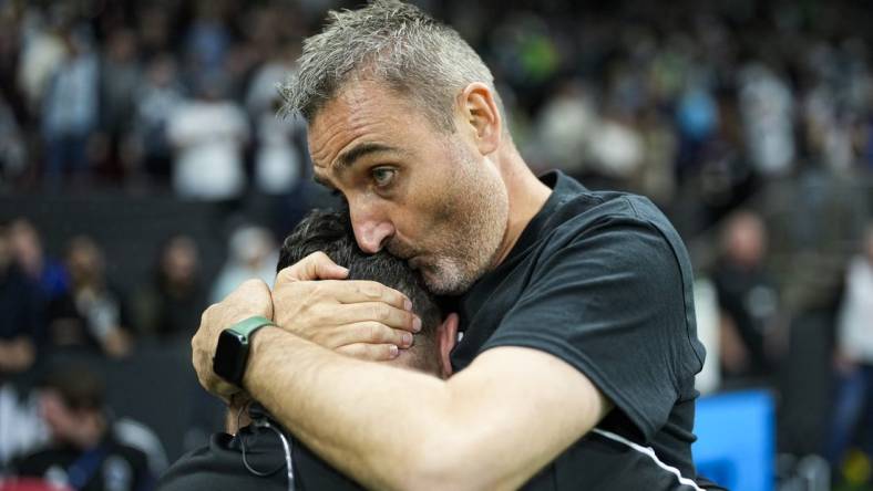 Sep 17, 2022; Vancouver, British Columbia, CAN; Vancouver Whitecaps head coach Vanni Sartini embraces a member of the coaching staff while celebrating after defeating the Seattle Sounders 2-1 at BC Place. Mandatory Credit: Bob Frid-USA TODAY Sports