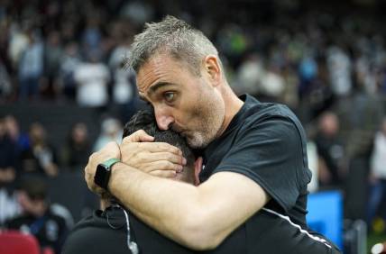 Sep 17, 2022; Vancouver, British Columbia, CAN; Vancouver Whitecaps head coach Vanni Sartini embraces a member of the coaching staff while celebrating after defeating the Seattle Sounders 2-1 at BC Place. Mandatory Credit: Bob Frid-USA TODAY Sports