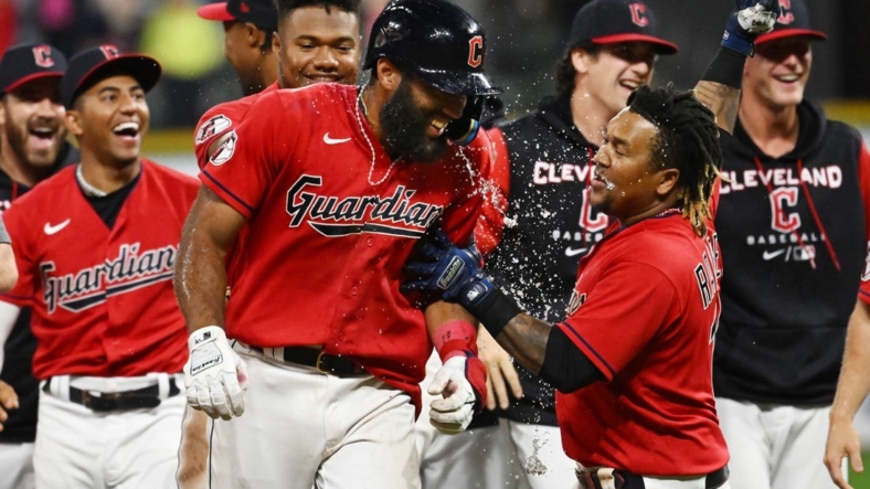 Sep 17, 2022; Cleveland, Ohio, USA; Cleveland Guardians shortstop Amed Rosario, middle, celebrates with teammates after hitting an RBI single to win the game during the fifteenth inning against the Minnesota Twins at Progressive Field. Mandatory Credit: Ken Blaze-USA TODAY Sports