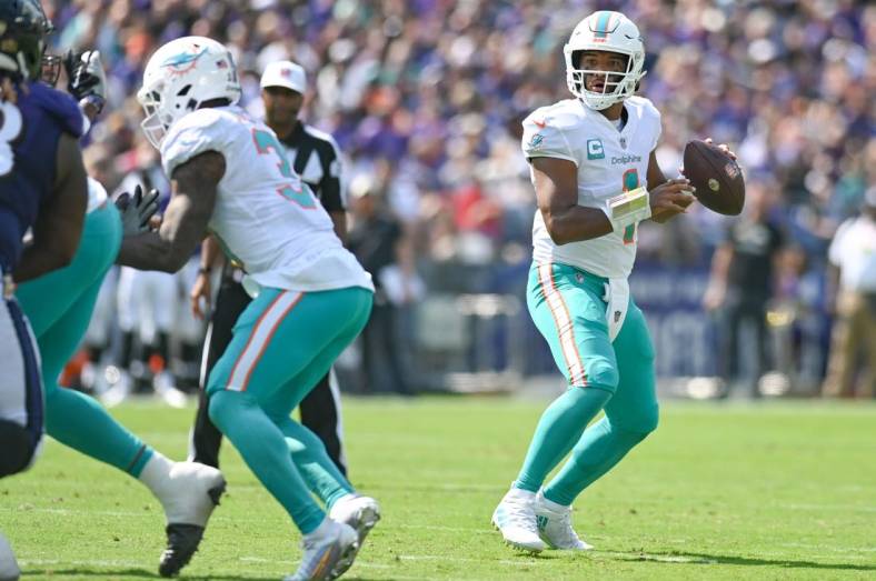 Sep 18, 2022; Baltimore, Maryland, USA;  Miami Dolphins quarterback Tua Tagovailoa (1) looks to throw during the first half against the Baltimore Ravens at M&T Bank Stadium. Mandatory Credit: Tommy Gilligan-USA TODAY Sports