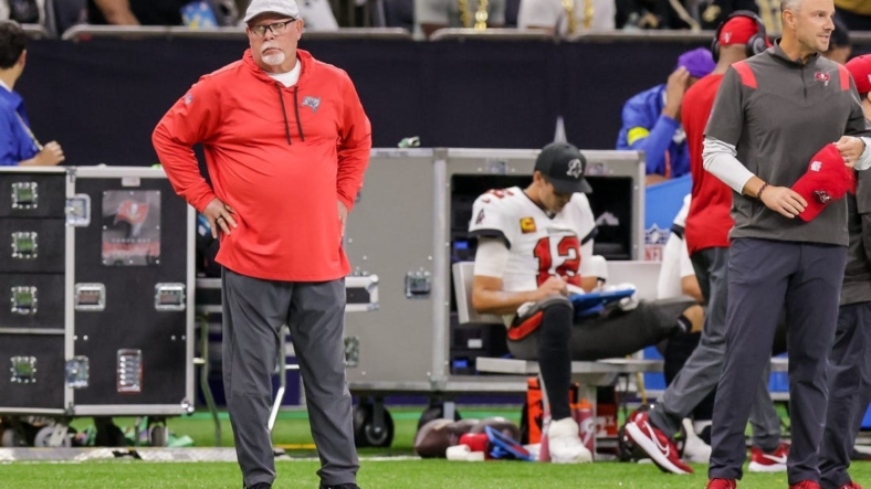 Sep 18, 2022; New Orleans, Louisiana, USA; Tampa Bay Buccaneers Senior Football Consultant Bruce Arians reacts to a play as quarterback Tom Brady (12) looks over the play from the bench against the New Orleans Saints during the first half at Caesars Superdome. Mandatory Credit: Stephen Lew-USA TODAY Sports