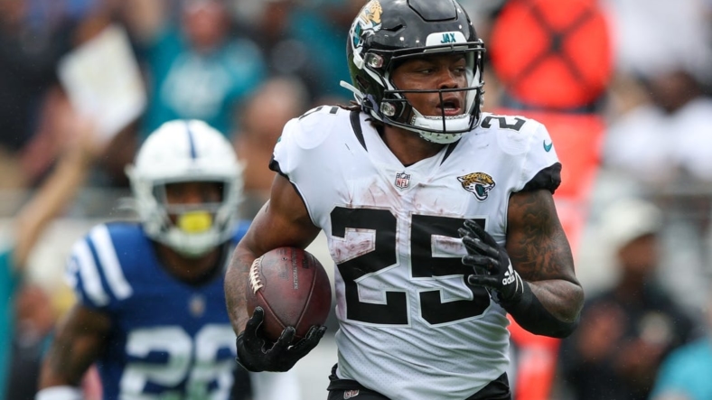 Sep 18, 2022; Jacksonville, Florida, USA;  Jacksonville Jaguars running back James Robinson (25) runs for a touchdown against the Indianapolis Colts in the second quarter at TIAA Bank Field. Mandatory Credit: Nathan Ray Seebeck-USA TODAY Sports