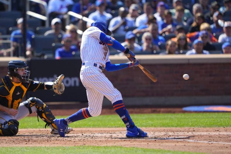 Sep 18, 2022; New York City, New York, USA; New York Mets center fielder Brandon Nimmo (9) hits a single against the Pittsburgh Pirates during the second inning at Citi Field. Mandatory Credit: Gregory Fisher-USA TODAY Sports
