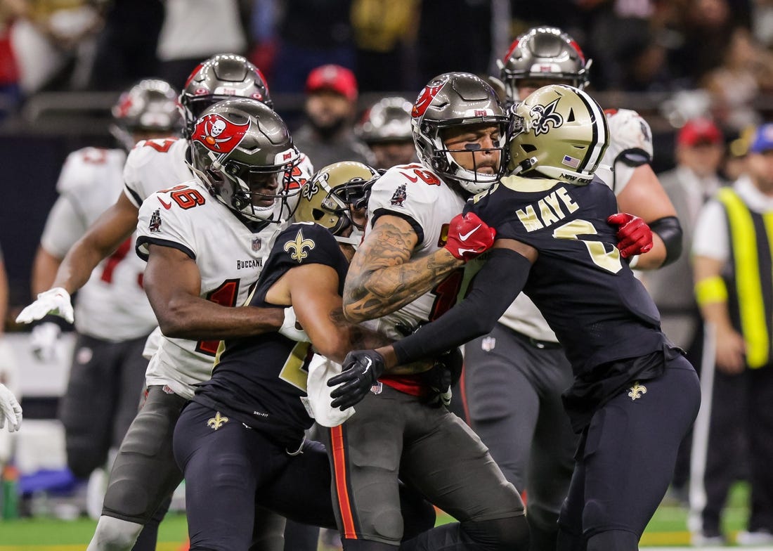 Sep 18, 2022; New Orleans, Louisiana, USA;  New Orleans Saints cornerback Marshon Lattimore (23) and safety Marcus Maye (6) get into a penalty with Tampa Bay Buccaneers wide receiver Mike Evans (13) and they are ejected after the play during the second half at Caesars Superdome. Mandatory Credit: Stephen Lew-USA TODAY Sports