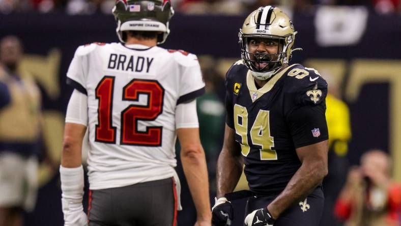 Sep 18, 2022; New Orleans, Louisiana, USA;  New Orleans Saints defensive end Cameron Jordan (94) stares at Tampa Bay Buccaneers quarterback Tom Brady (12) and reacts to a play during the second half at Caesars Superdome. Mandatory Credit: Stephen Lew-USA TODAY Sports