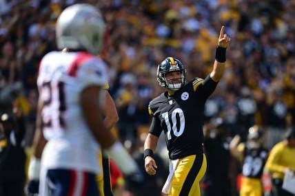 Sep 18, 2022; Pittsburgh, Pennsylvania, USA; Pittsburgh Steelers quarterback Mitch Trubisky (10) celebrates after scoring a touchdown during the fourth quarter against the New England Patriots at Acrisure Stadium. Mandatory Credit: David Dermer-USA TODAY Sports